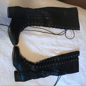 Brand New knee high black pleather boots.